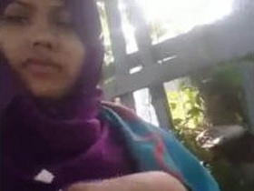 Muslim girl in hijab enjoys romantic outdoor time with her boyfriend